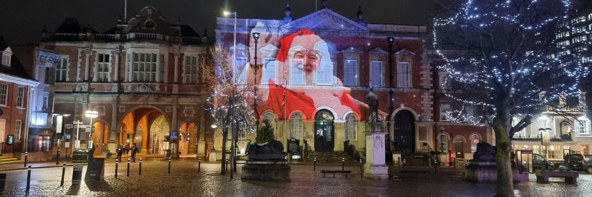 Santa in light projection on The Old Courthouse